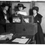 Three suffragists casting votes in New York City